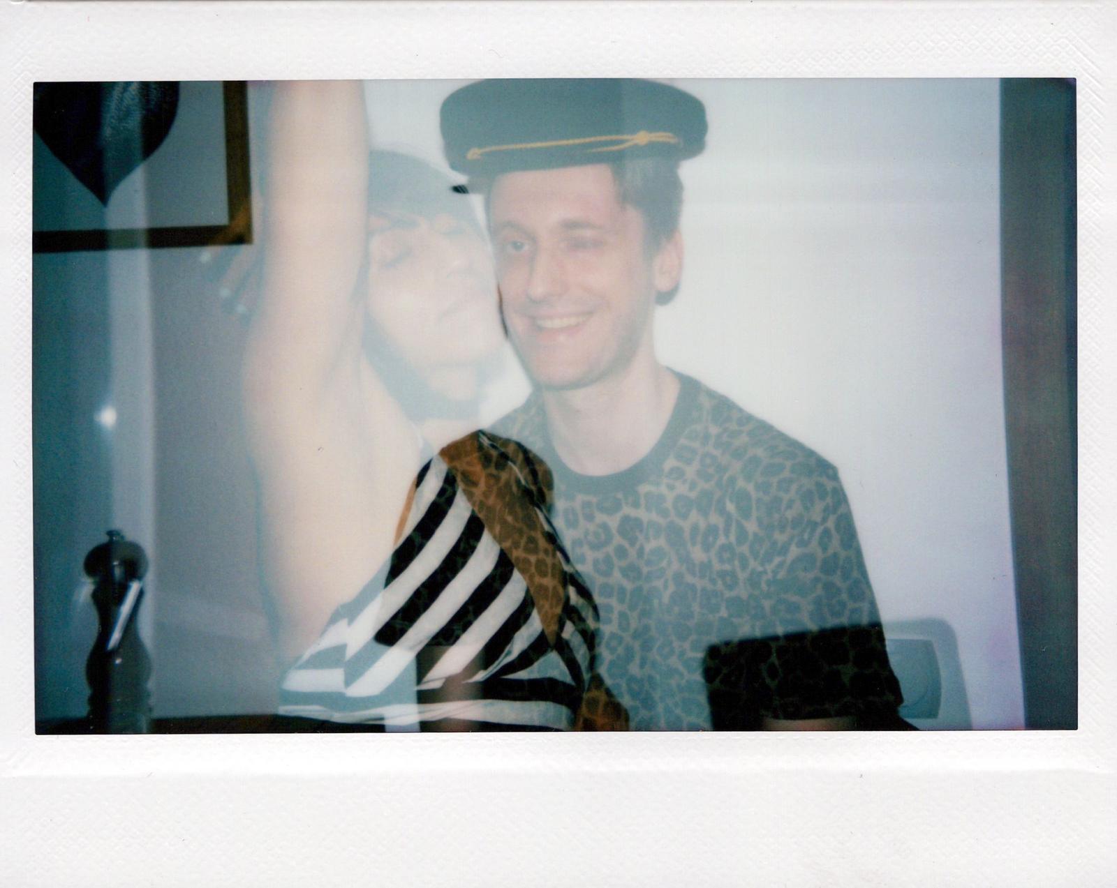 Two figures, red light